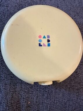 Caboodles Yellow Case with Multicolor Geometric Logo